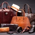 A luxurious collection of premium leather products, including handbags, wallets, belts, shoes, and travel bags.