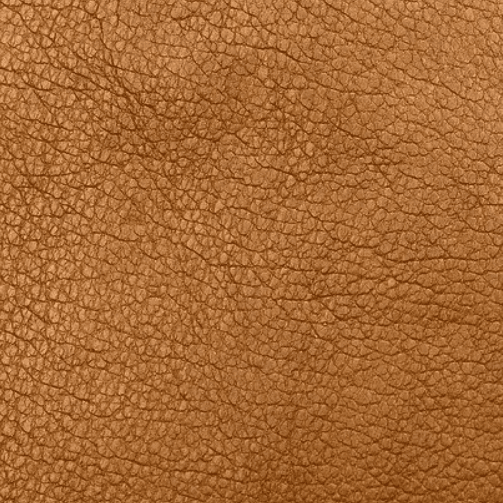 Real Leather – Premium Quality and Natural Grain Texture. Close-up texture of real leather with a natural grain pattern and warm brown color.
