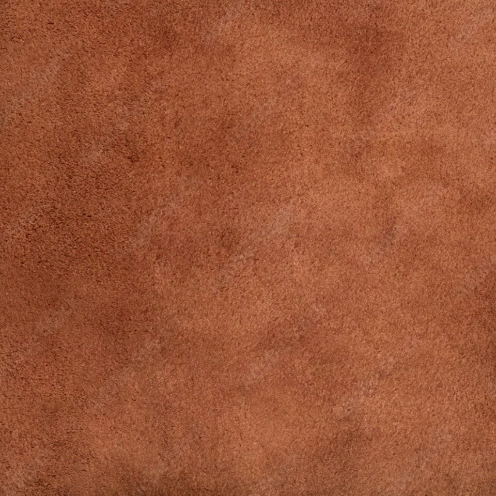 Suede Leather: Soft, Elegant, and Perfect for Luxurious Designs. Close-up of brown suede leather, highlighting its soft, brushed texture and velvety surface.