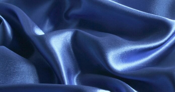 Smooth and silky blue Lyocell fabric with a luxurious shine and soft drape.