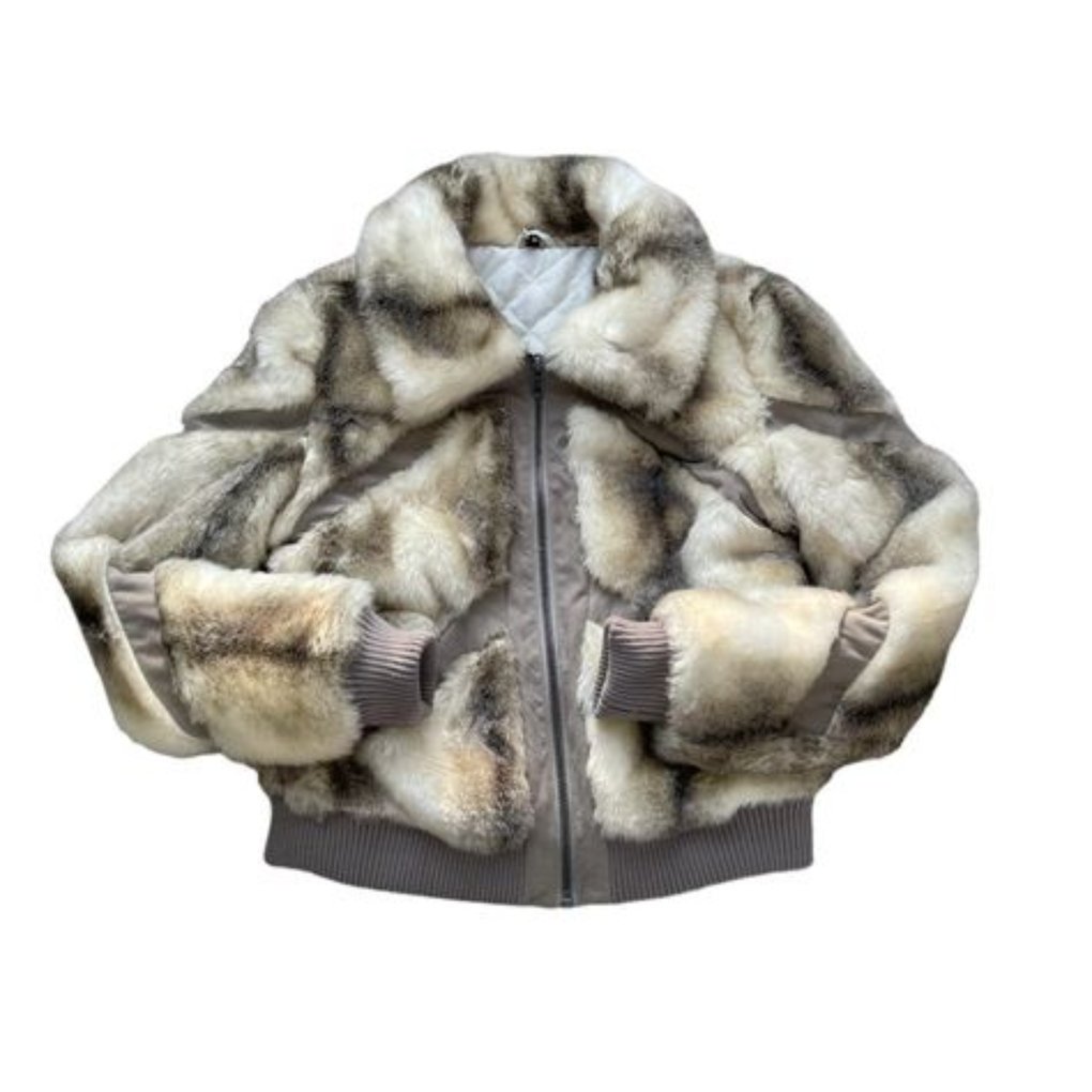 A cozy brown faux fur bomber jacket with a zip front and ribbed cuffs. The inner lining is visible, showcasing a soft texture.