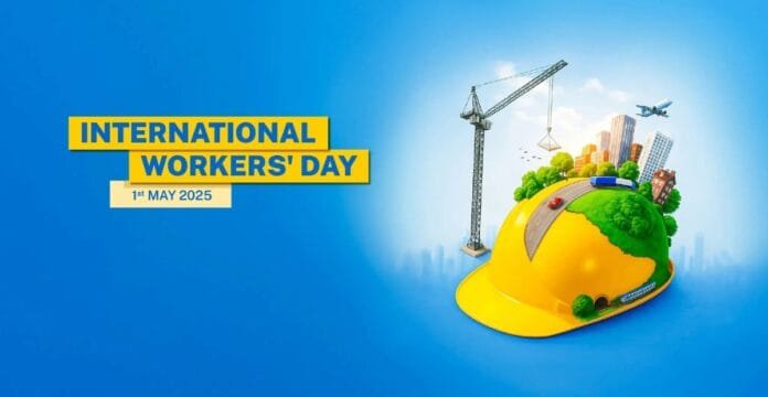 A graphic celebrating International Workers' Day with a yellow construction helmet, city buildings, a crane, trees, a plane, and a car on a bright blue background. The text reads 