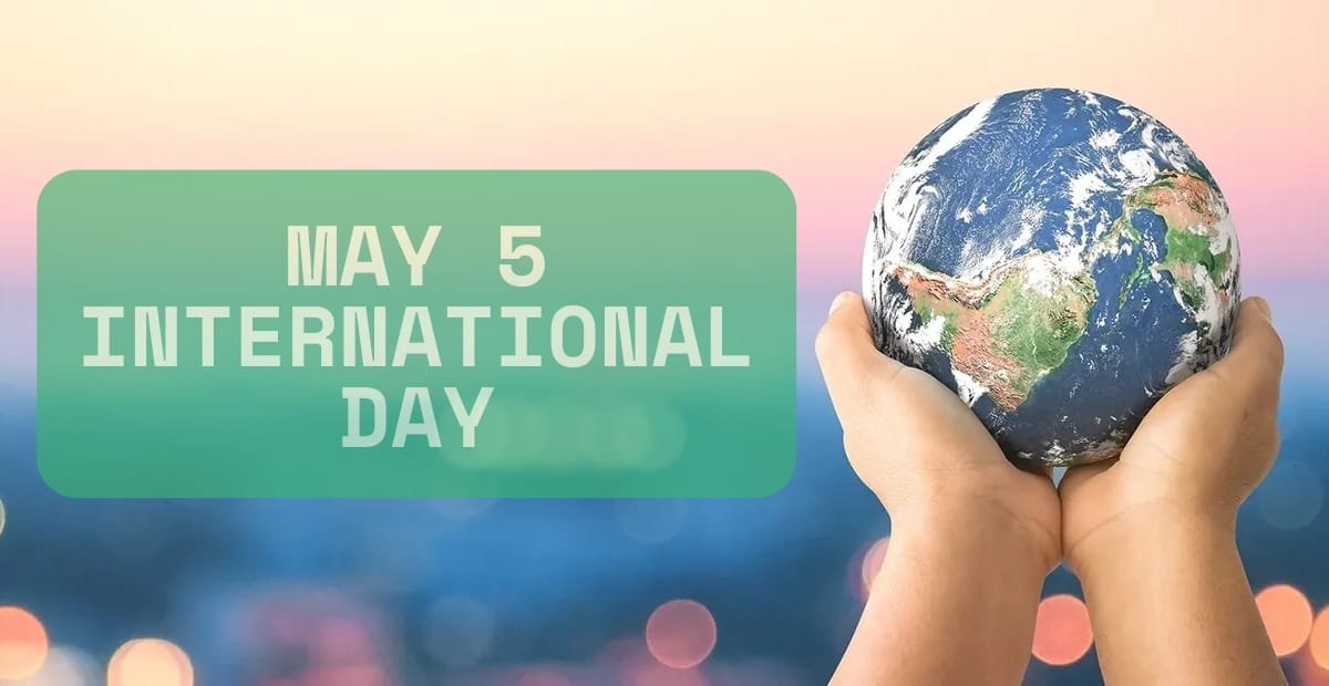 Two hands hold a small globe of Earth against a blurred pink and blue background, with a green box on the left side containing the text "May 5 International Day."