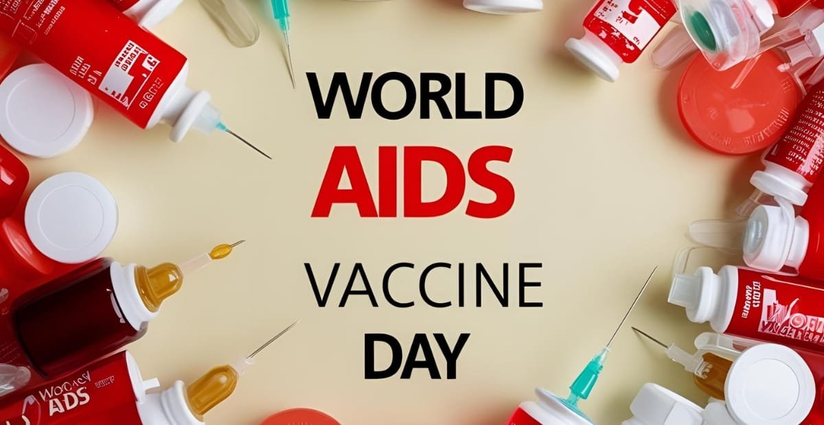 An arrangement of various vaccine bottles, syringes, and ampoules surrounding a beige background with the bold text "World AIDS Vaccine Day" in the center.