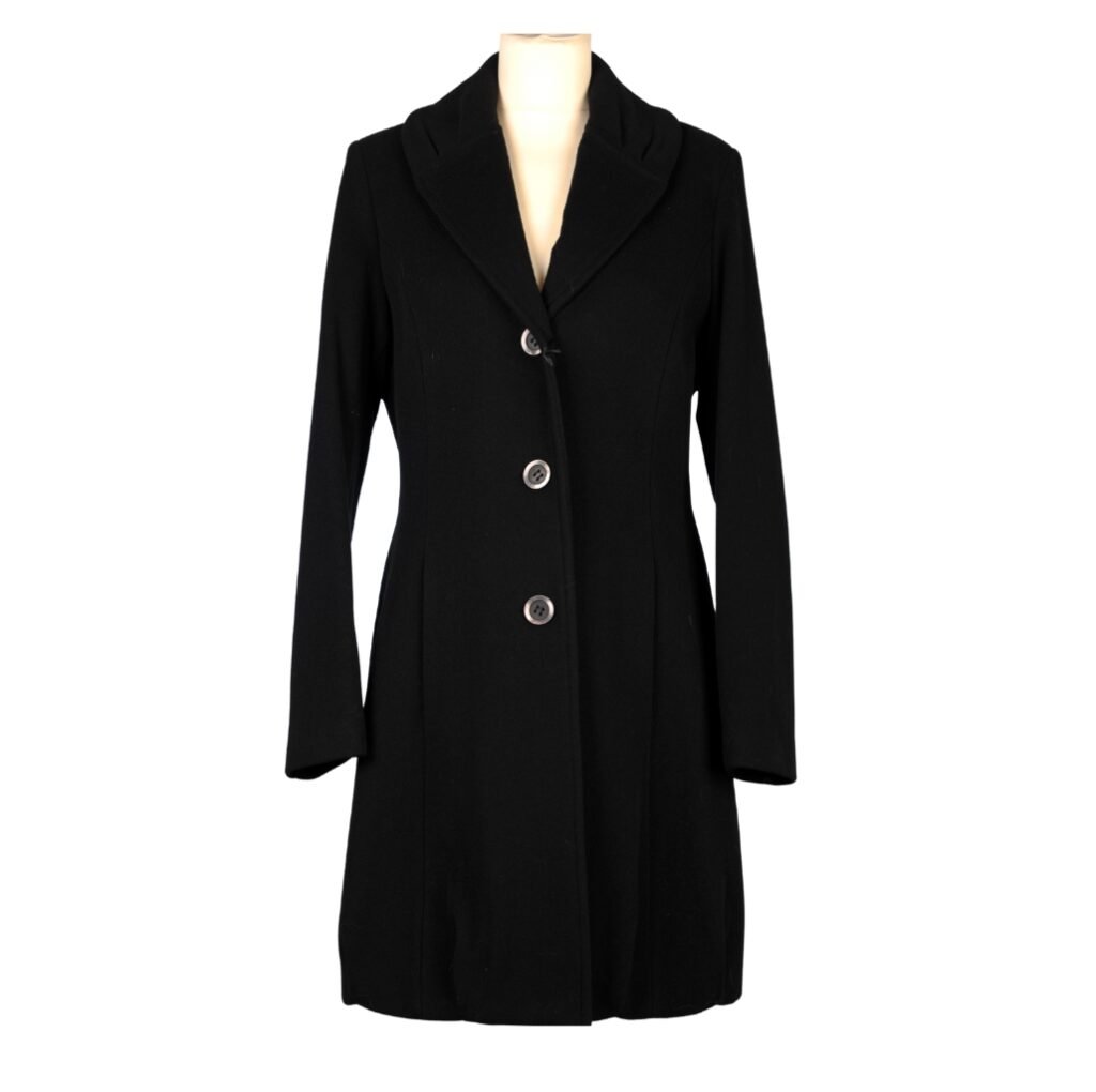 A classic black wool coat displayed on a mannequin, featuring a tailored fit with large buttons and a wide collar.