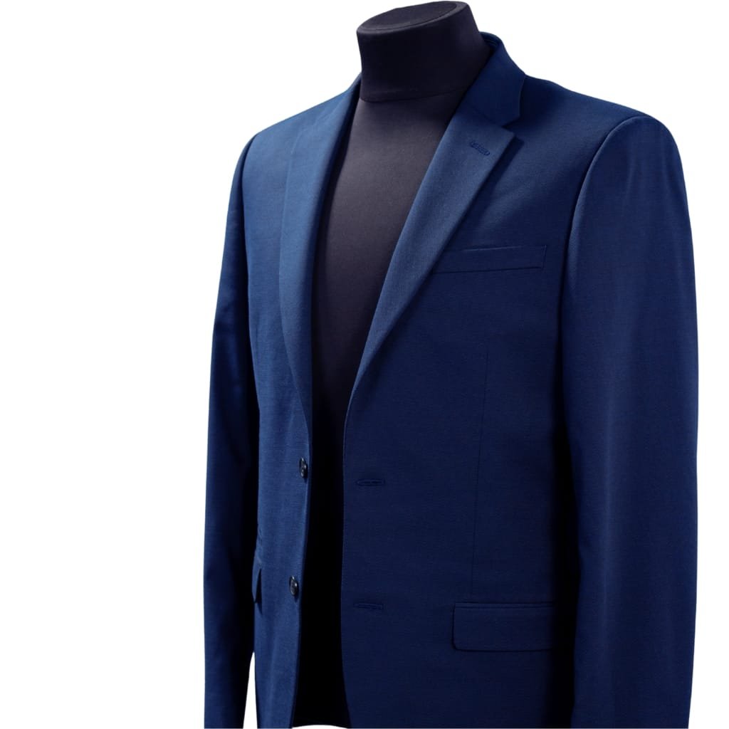 What Is a Leather Jacket? A Timeless Icon of Style and Attitude 32 A stylish navy blue blazer-style jacket displayed on a mannequin with a black turtleneck underneath.