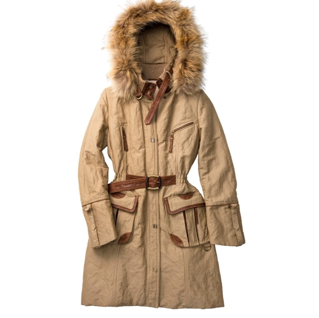 A long beige winter coat with a faux fur-lined hood, multiple pockets, and a brown belt, designed for strong weather protection.