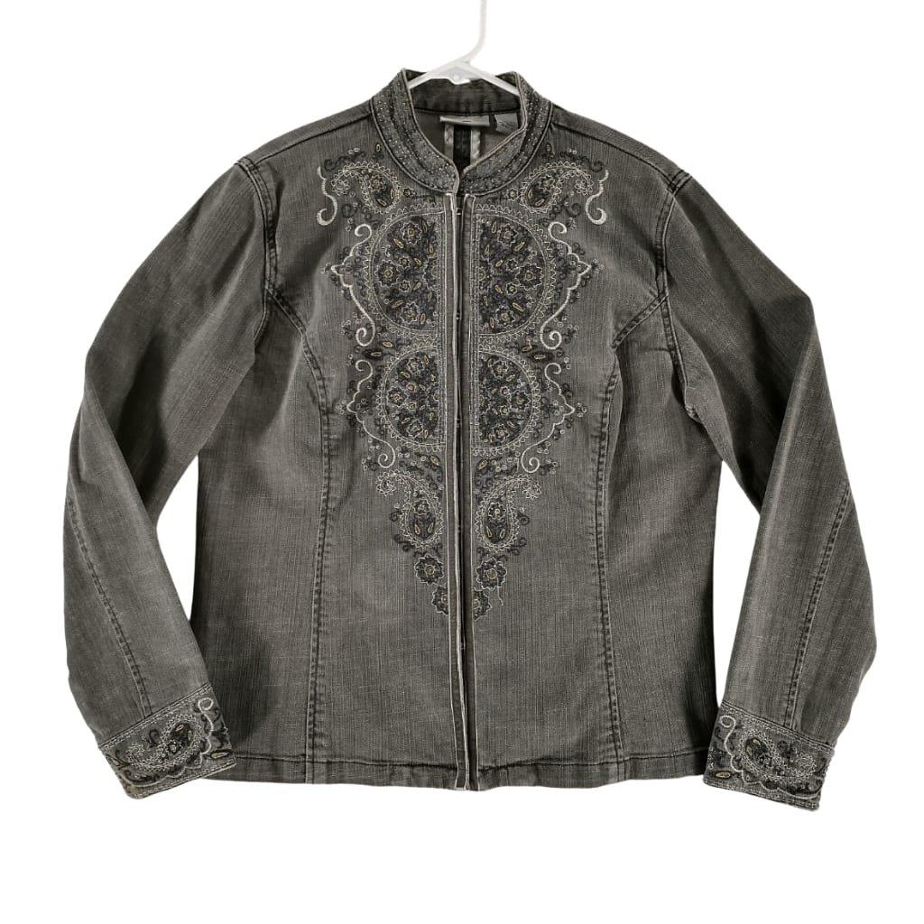 A gray denim jacket featuring intricate embroidered patterns in shades of black, gold, and white on the front, collar, and cuffs, displayed on a white hanger against a white background.
