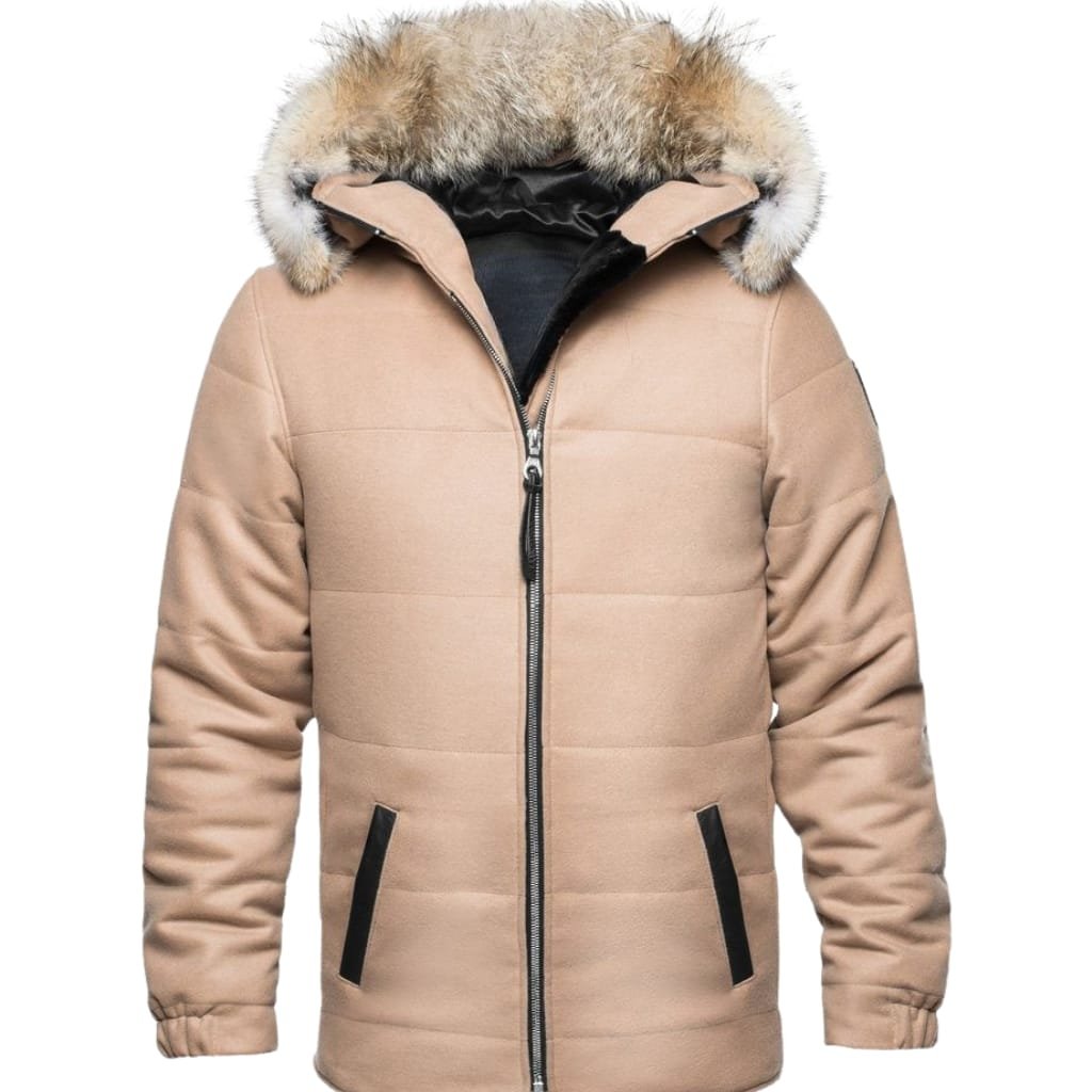 "Person wearing an Alaska winter jacket in snowy landscape, highlighting features like insulation and waterproof material."

