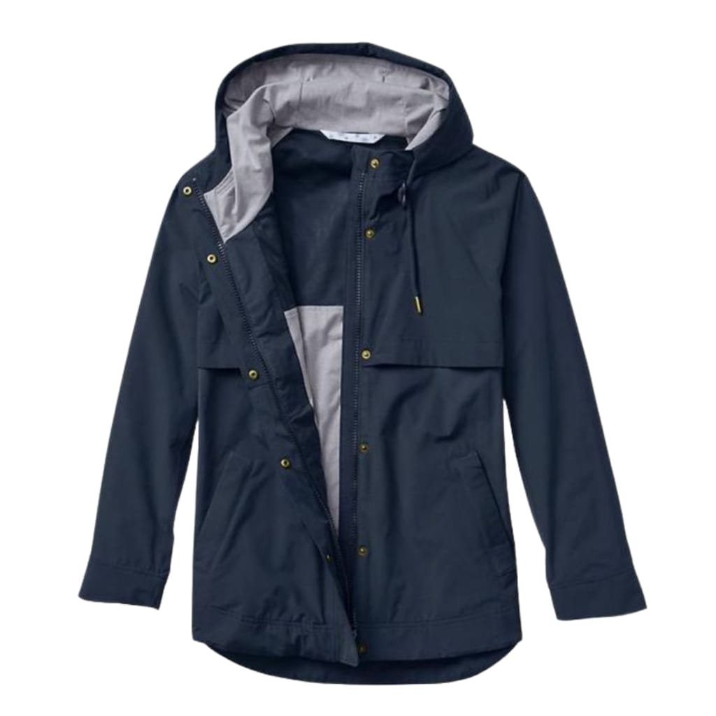 A dark navy blue waterproof jacket with a light grey hood lining, featuring multiple front pockets, a zipper closure, and snap buttons, designed to withstand heavy rain and wind.

