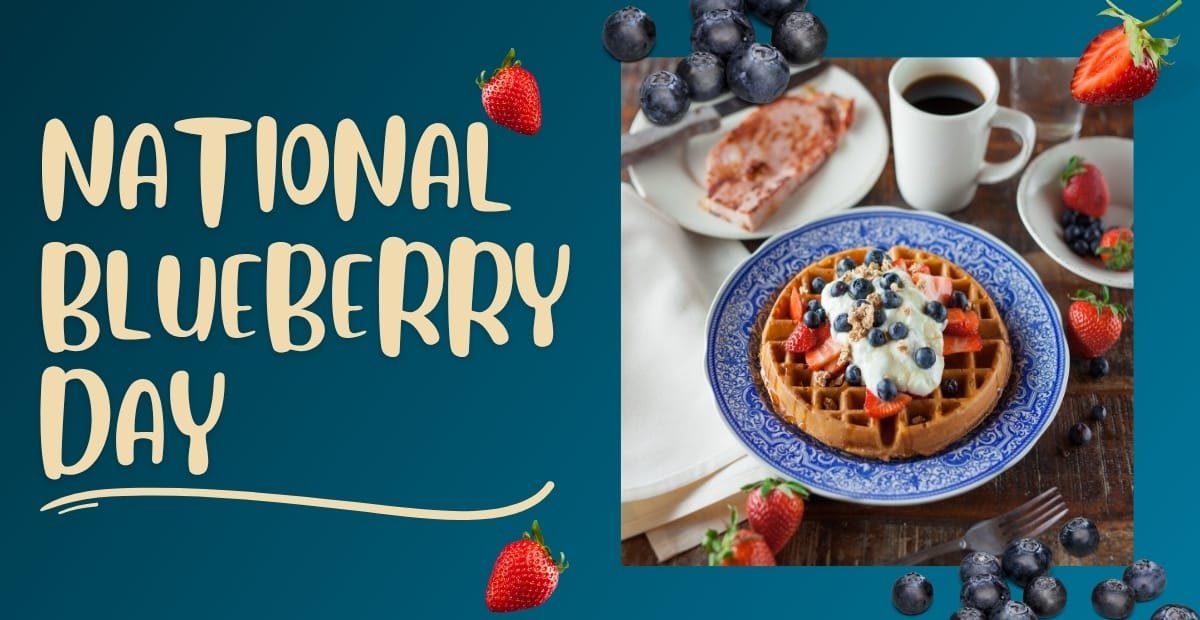 A colorful display celebrating National Blueberry Day, featuring a plate with a waffle topped with whipped cream, blueberries, and strawberries, alongside fresh blueberries, strawberries, a cup of coffee, and slices of cake on a wooden table.