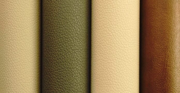 Close-up image of five textured leather rolls in shades of beige, green, cream, and brown arranged vertically.