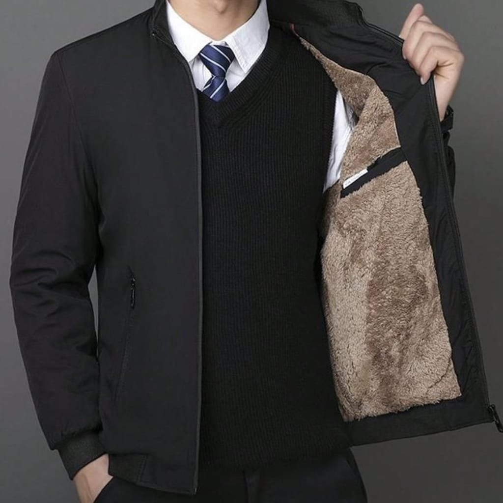 Person wearing a black jacket with the inner lining of the jacket visible, showing its plush, fuzzy interior.

