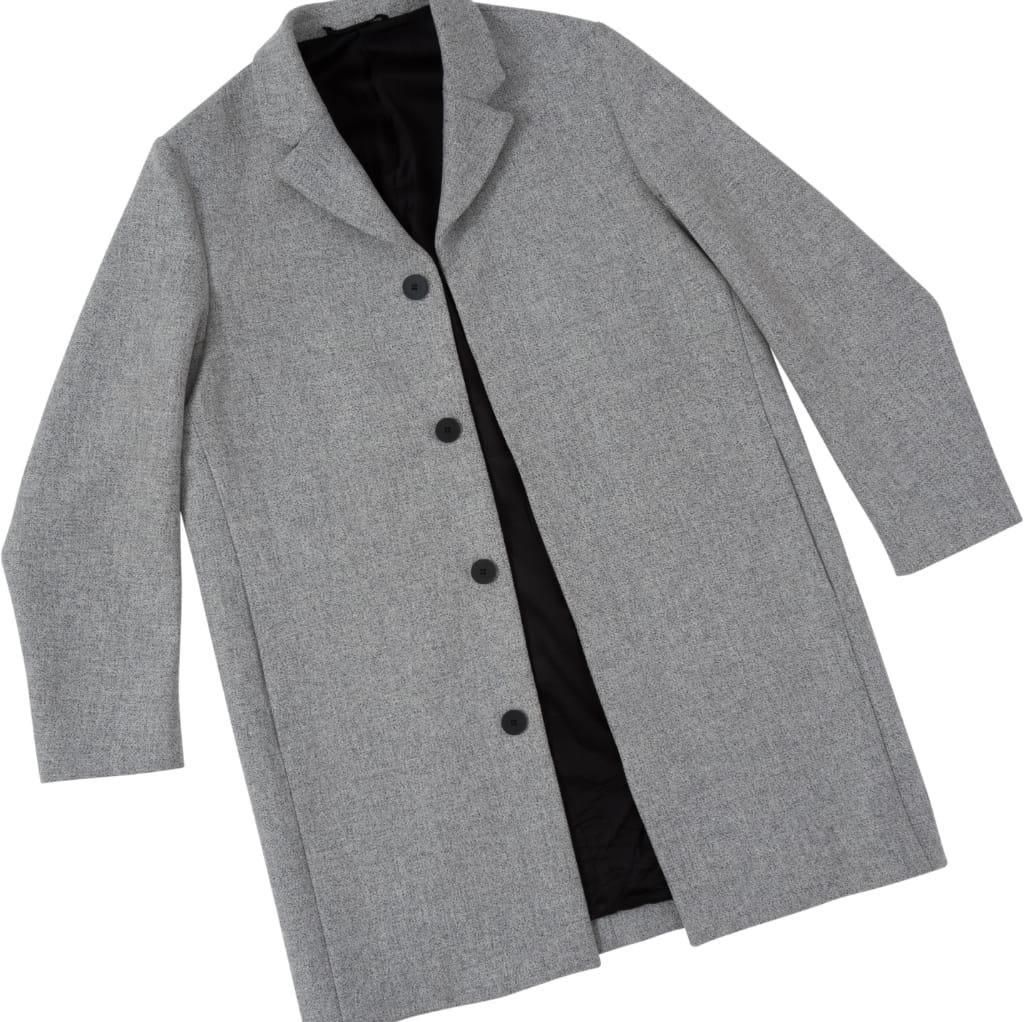 A stylish men's wool jacket in light gray with a classic cut, featuring a lapel collar, four black buttons down the front, and a sleek, tailored fit. The jacket is displayed on a plain background, highlighting its elegant design.