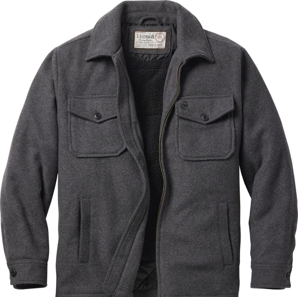 A stylish dark gray wool men's jacket with a front zipper, two chest flap pockets, and two side pockets, showcasing a sleek and modern design.