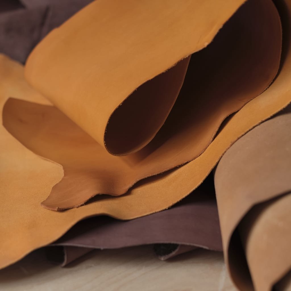 Flexible buffalo leather used in jackets, bags, furniture, and accessories for durability and comfort.