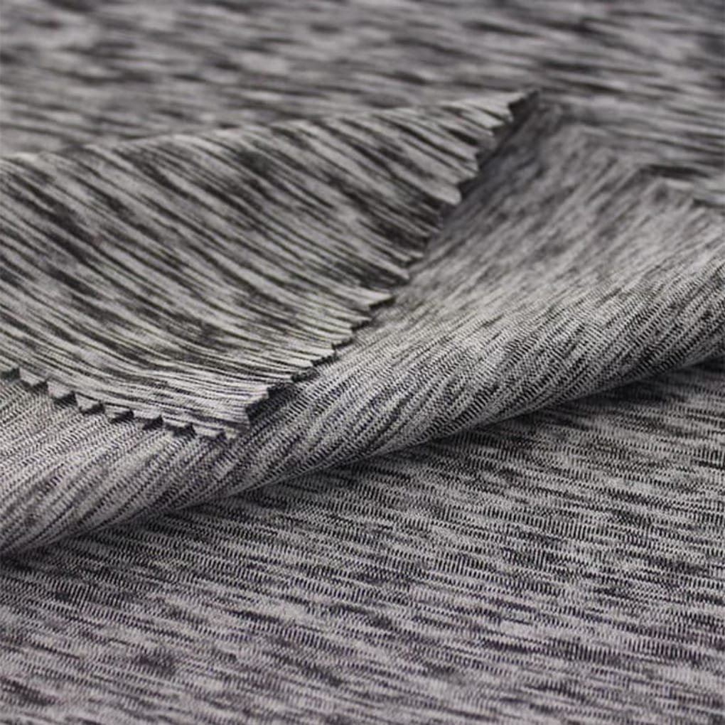 Close-up of layered denim fabric in a heathered gray tone, showing the tight weave and folded edge.