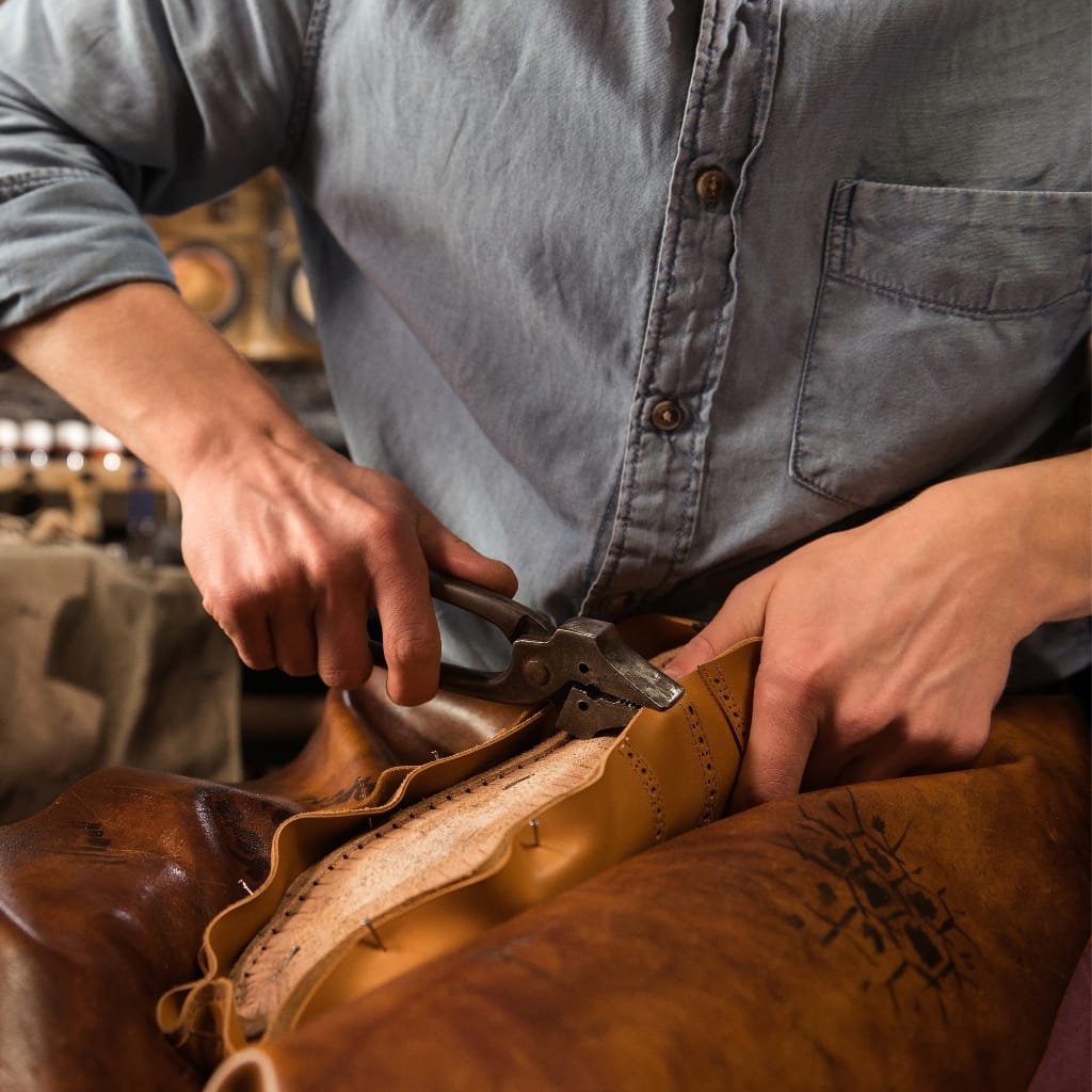 Buffalo hide being removed and prepared for leather processing.