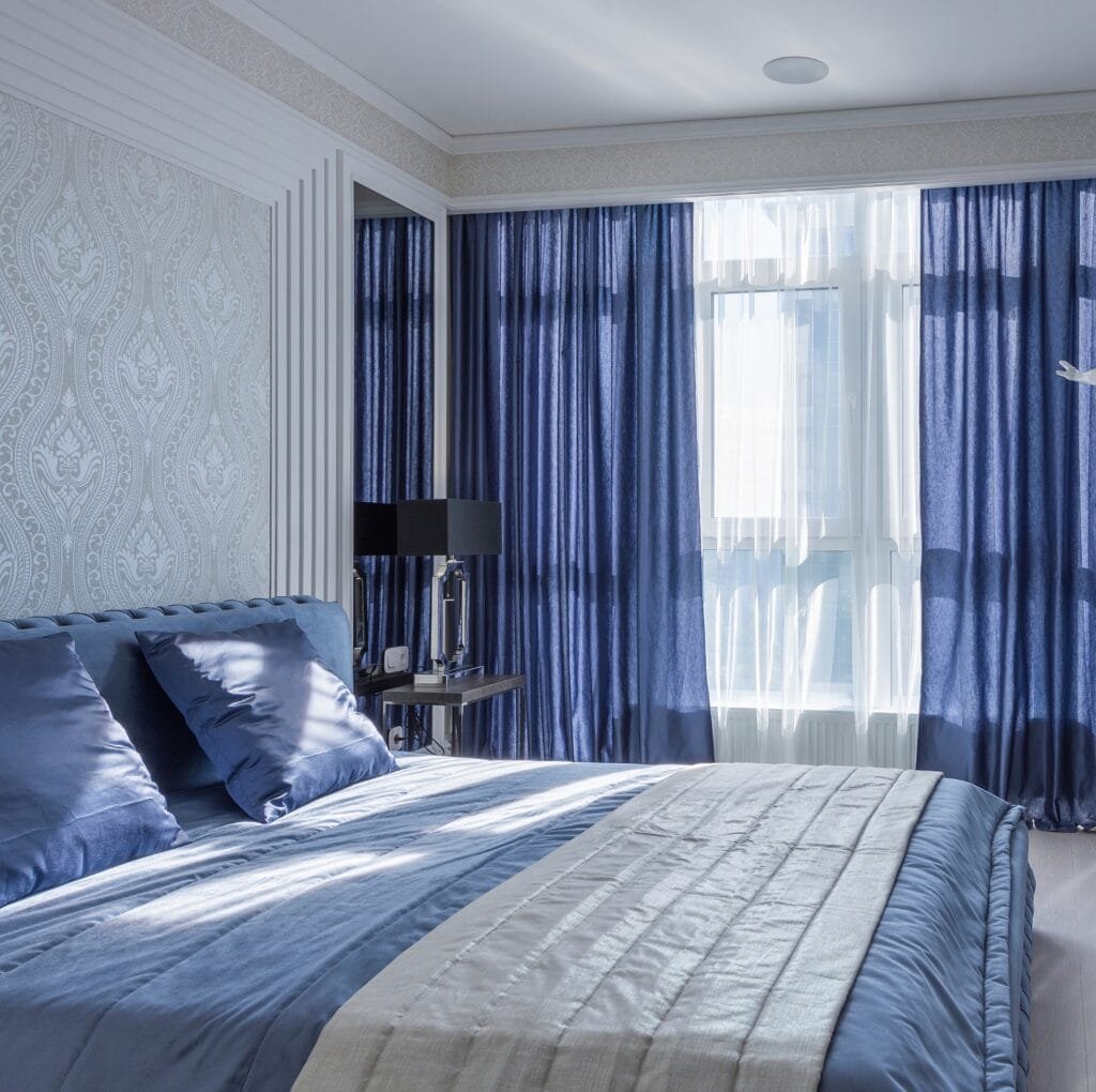 A close-up of elegant linen fabric with a subtle Huckaback texture, showing a slightly raised weave pattern rich in linen’s natural fibers. Textured Huckaback linen draped as a window treatment, with soft light filtering through the weave and a refined, airy feel.