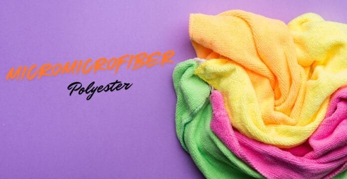 A purple background with a multicolored scarf/towel on the right in yellow, orange, pink, and green tones. On the left, orange stylized text reads “MICROFIBER” and black script “Polyester” beneath it.