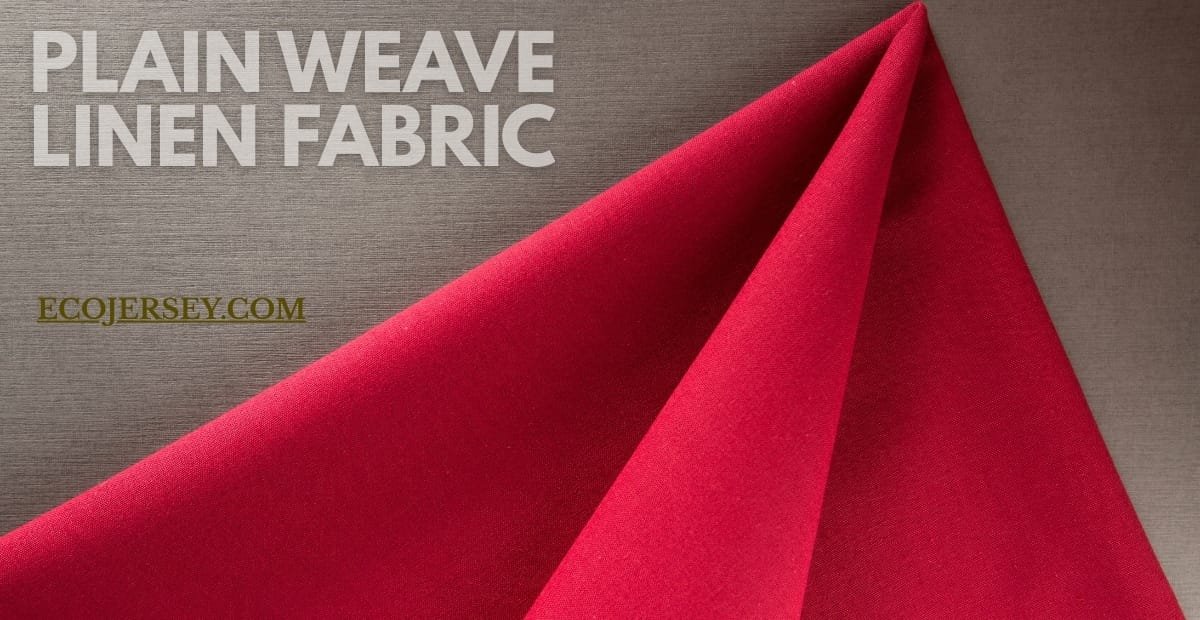 Plain Weave Linen Fabric: The Ultimate Guide to Style & Comfort A close-up photo of vibrant red plain weave linen fabric draped diagonally over a neutral background, showing smooth texture and sharp folds.