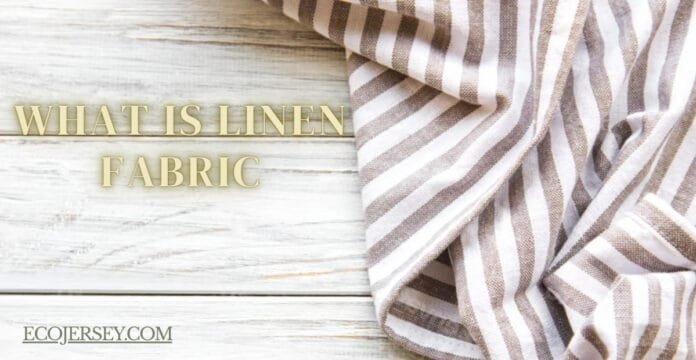 “A light-colored striped linen fabric draped on a white wooden surface, with the text ‘What Is Linen Fabric’ in gold lettering and a small ECOJERSEY logo in the corner.”