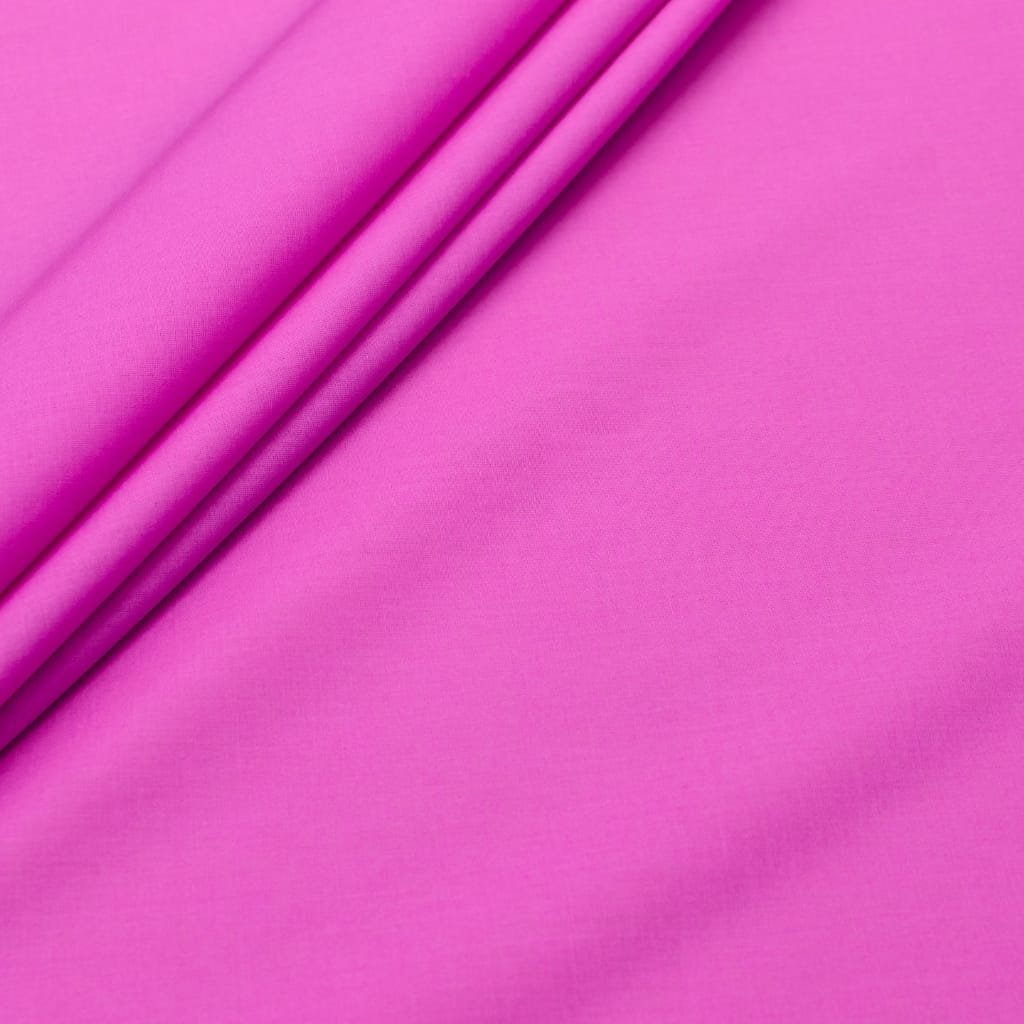 Close-up of a bright pink batiste cotton fabric with a smooth, lightweight, and sheer texture.