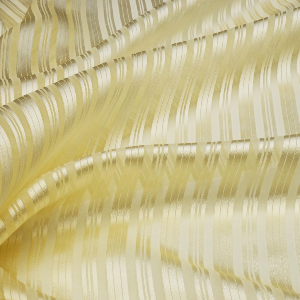 A close-up view of pale yellow organza fabric with delicate, shimmering stripes created by satin-y ribbons woven into a sheer, lightweight material.

