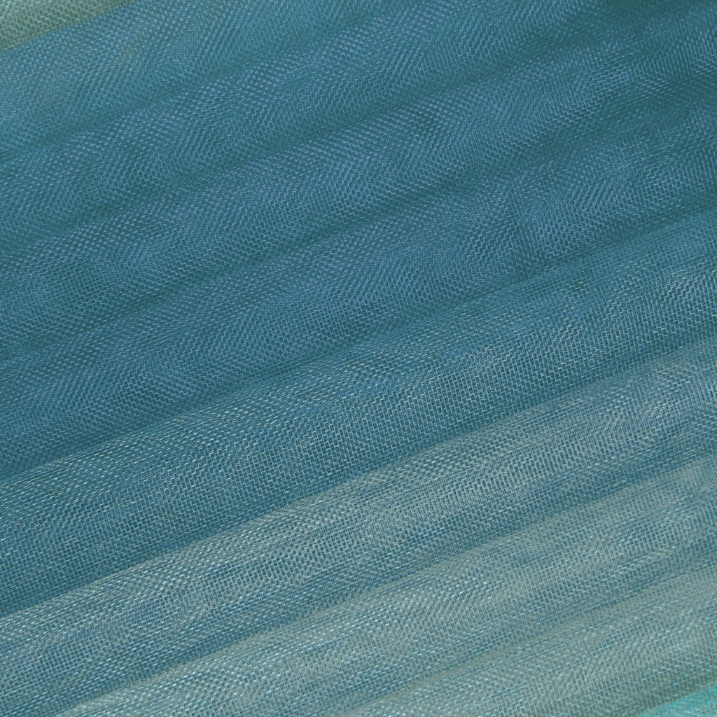 Close-up of turquoise shot organza fabric, showing diagonally woven ribbons and a sheer, crisp texture.

