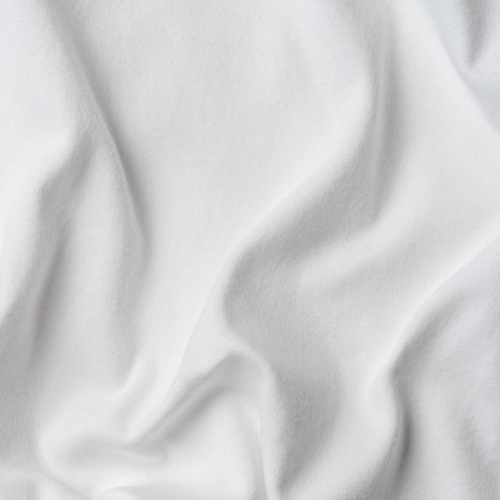 A smooth, bright white sheet of inexpensive Upland cotton fabric with soft folds and gentle shadows.