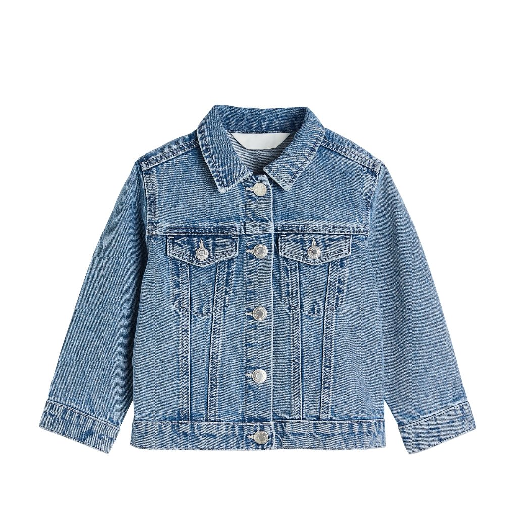 Child-sized blue denim jacket with metal buttons, chest pockets, and classic stitching on light-washed denim.