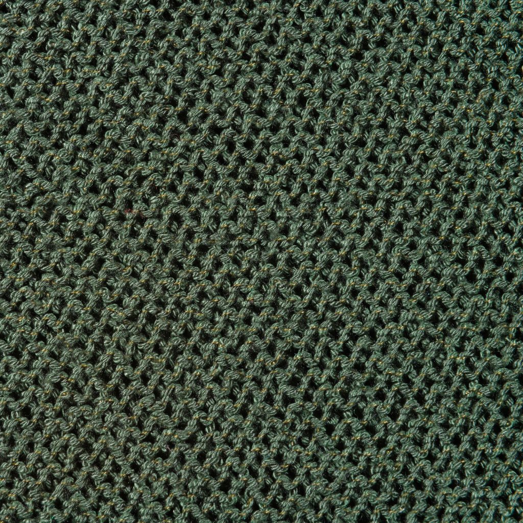Close-up view of dark green interlock fabric with small, repeating interlocking loops.