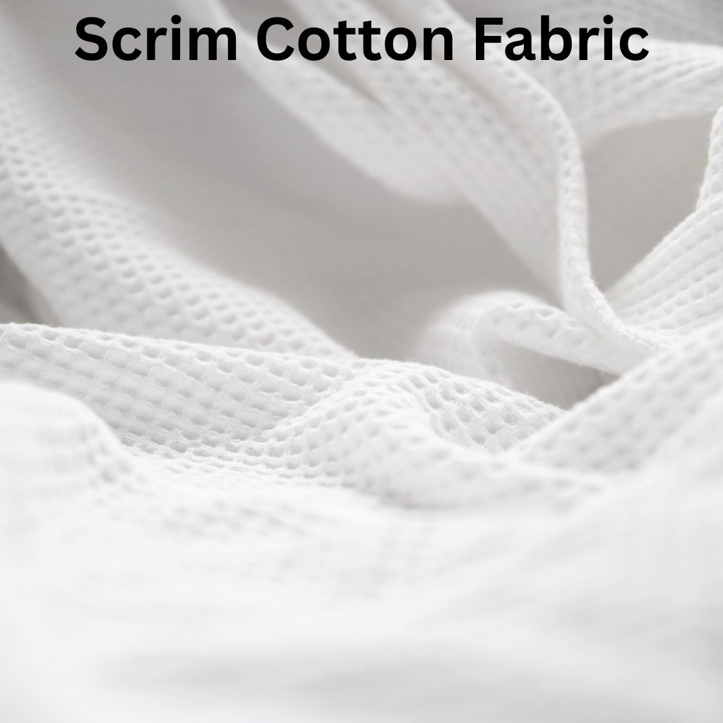 Scrim cotton fabric close-up showing soft, textured white material with small perforations.