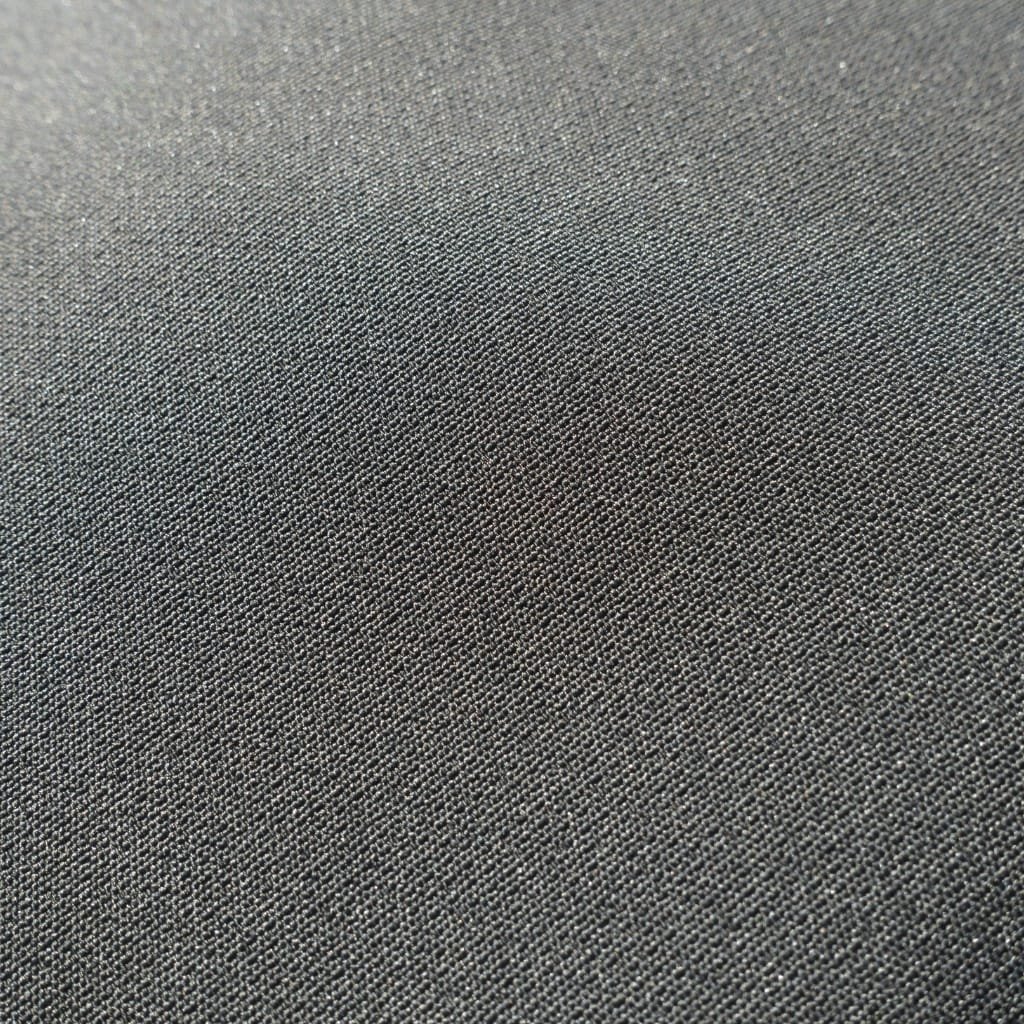 Close-up view of dark gray polyester fabric with a tight, even weave.