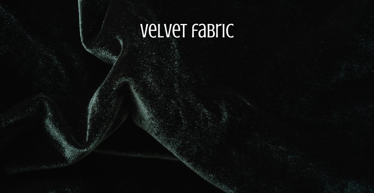 Close-up of rich black velvet fabric with a soft, luxurious sheen and gentle folds. Velvet Wool Fabric