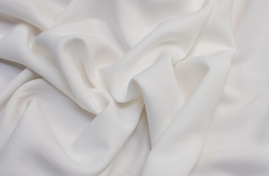 Soft white bamboo rayon fabric with gentle draping and subtle folds.