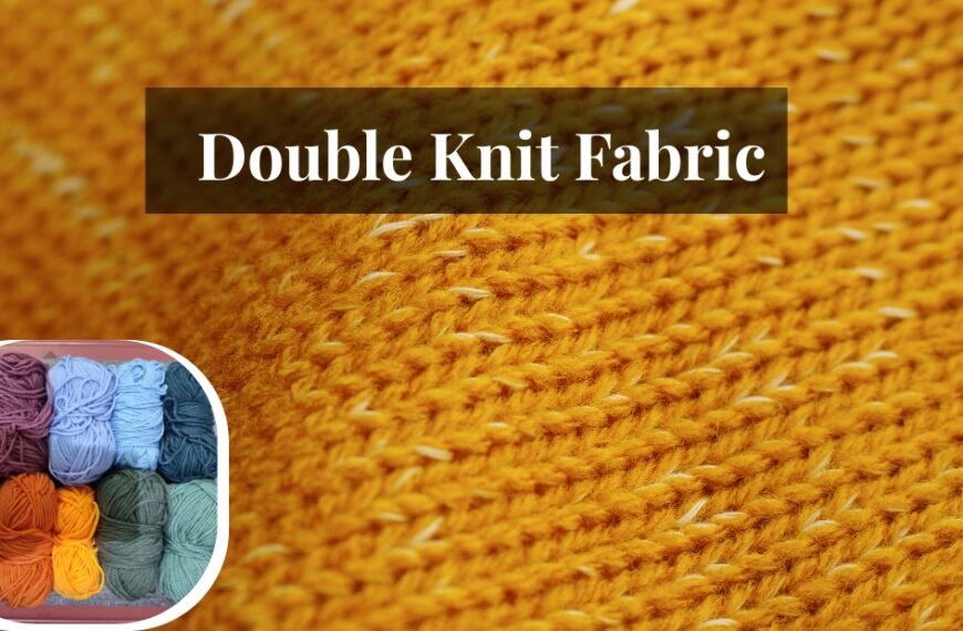 Close-up view of bright orange double knit wool fabric with a textured pattern.