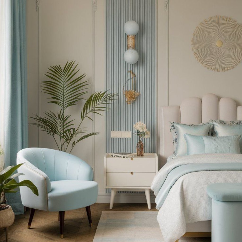 White Organza Fabric: Elegant Style for Dresses and Interiors 25 A bright, pastel-toned bedroom featuring a soft blue and cream color palette. The scene includes a curved light blue chair, a white nightstand with a vase of flowers, a cozy bed with pale blue and white bedding, a large green plant by the window, and decorative wall elements with vertical blue slats and a round sunburst wall décor.