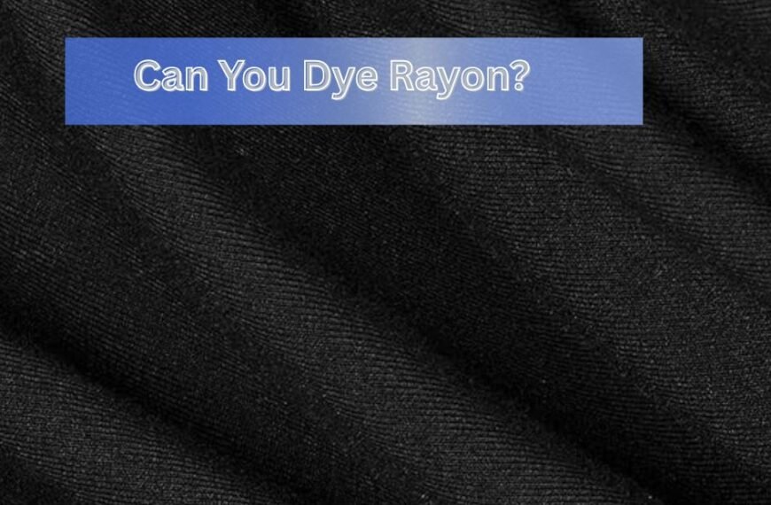 A close-up of black rayon fabric with a text overlay that reads, "Can You Dye Rayon?"
