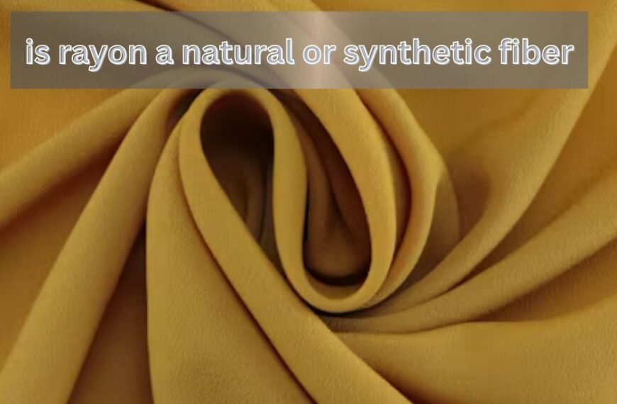 Close-up of soft yellow rayon fabric with text asking if rayon is a natural or synthetic fiber.