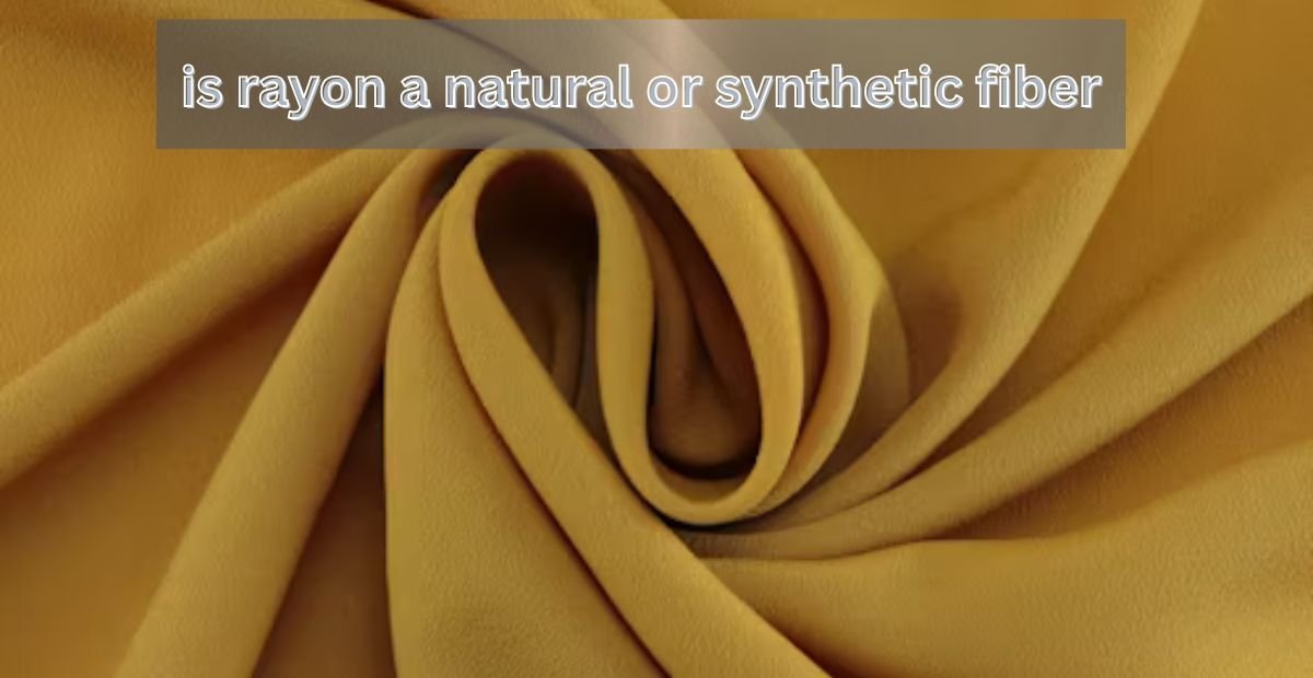 Close-up of soft yellow rayon fabric with text asking if rayon is a natural or synthetic fiber.