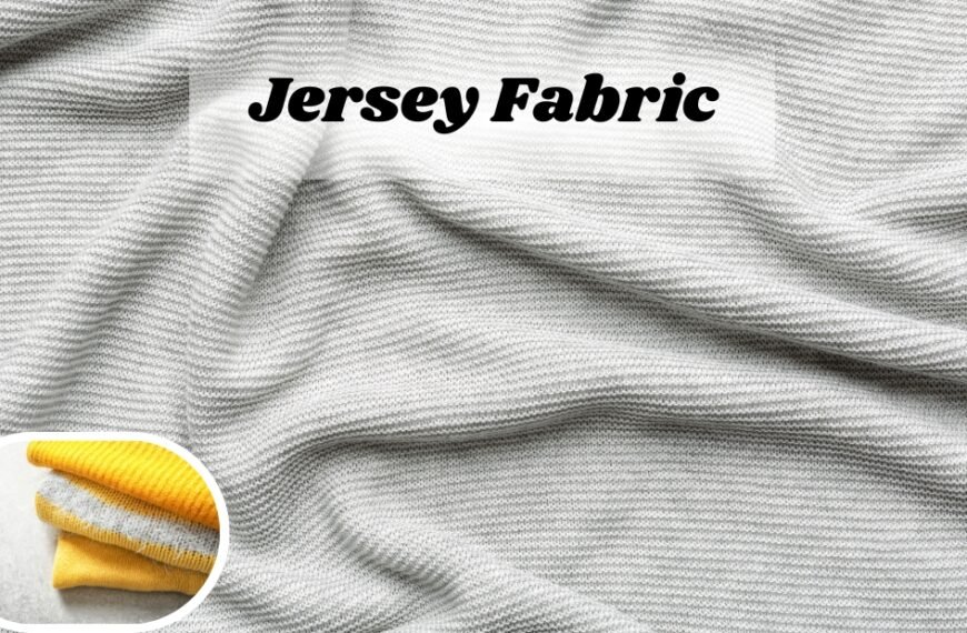 Close-up view of soft gray jersey knit wool fabric with subtle texture and folds; small inset shows yellow and white folded fabric.