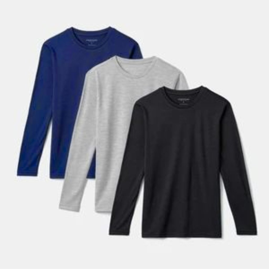 Three plain long-sleeve T-shirts in blue, gray, and black arranged in a row.
