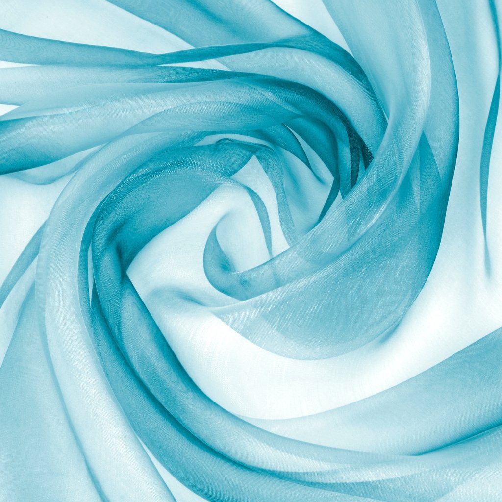 How to Sew Organza Fabric Like a Pro: Essential Sewing Tips 10 A lightweight, sheer, and crinkly translucent fabric in pale blue, shown in a swirling, layered drape that highlights its delicate, airy texture.