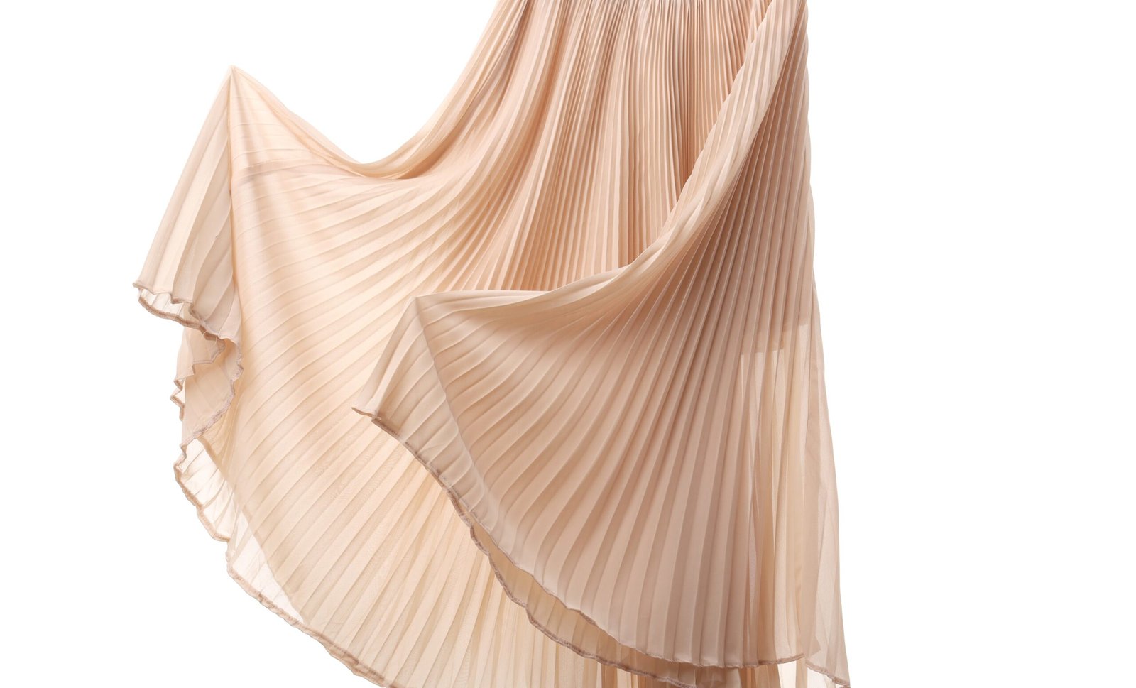 flowing rayon fabric skirt in soft champagne color with deep pleats cascading in a diagonal and graceful drape"