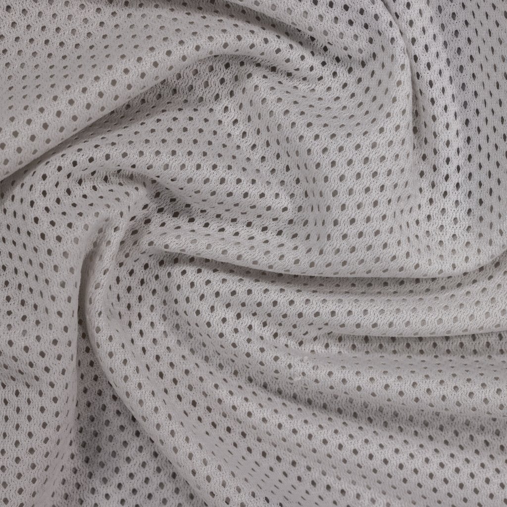 A close-up of soft, light-gray knit fabric with small, evenly spaced perforated holes creating a mesh-like texture. chintz cotton fabric
