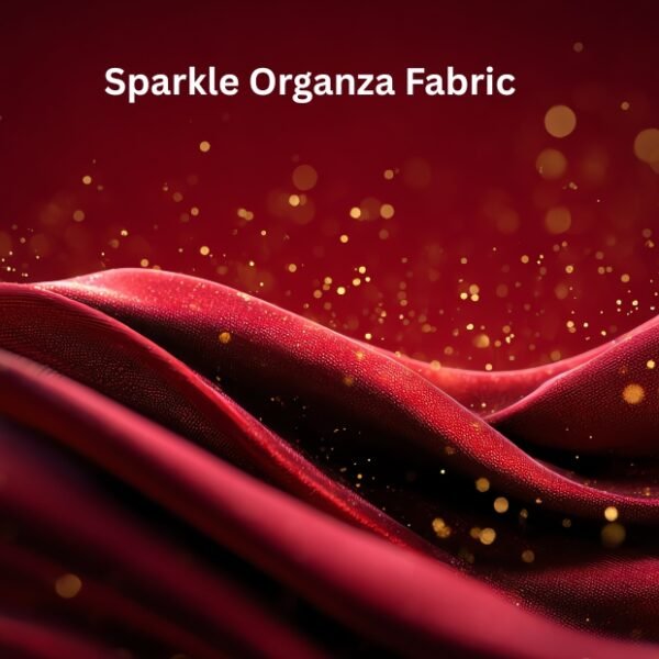 Close-up view of shimmering red and pink sparkle organza fabric with gold specks and flowing waves. Sparkle Organza Fabric