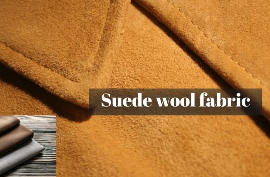 Close-up view of soft suede wool fabric in warm caramel tone with a subtle nap, featuring diagonal folds.