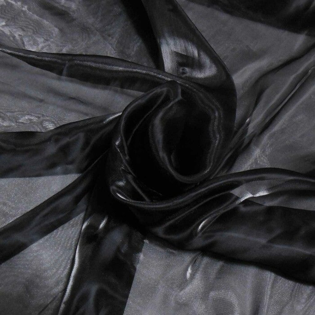 Black Organza Fabric: A Timeless Choice for Stylish Outfits 10 Close-up of shiny black fabric (likely satin or slick material) twisted in a knot, showing folds and a glossy surface.