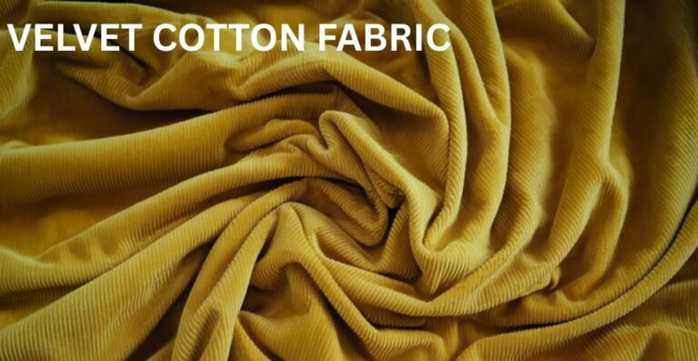 Close-up of mustard-yellow velvet cotton fabric draped in soft folds.